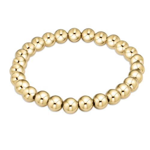 Enewton Classic Gold 7MM Bead Bracelet featuring round gold beads on a sleek, stylish accessories design.