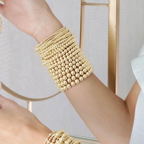 Enewton classic gold 8mm bead bracelet featuring round gold beads on a durable string for stylish accessories.