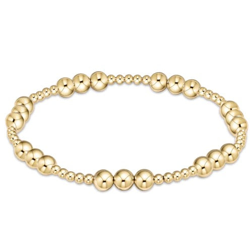 Gold beaded bracelet with classic joy pattern, 5mm beads, stylish accessory by Enewton, shown on a neutral background.