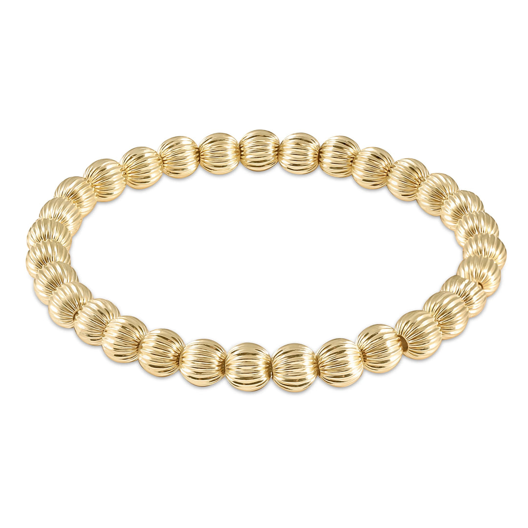 Enewton Dignity Gold 6mm bead bracelet showing gold-toned beads on an elastic bracelet for accessories.
