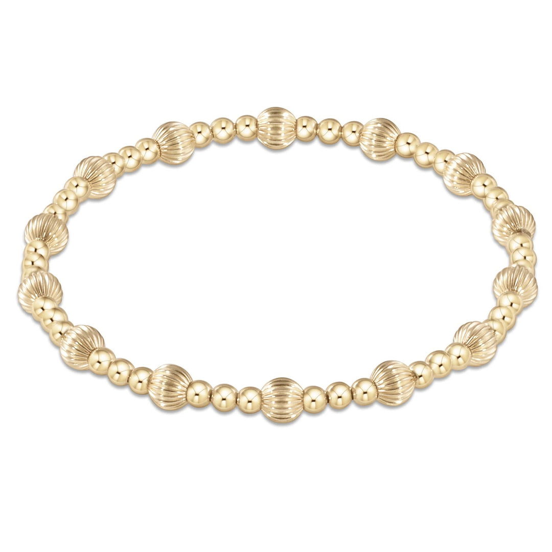 Enewton Dignity Sincerity Pattern Gold 5mm Bead Bracelet, stylish accessories with intricate bead design, worn as jewelry.