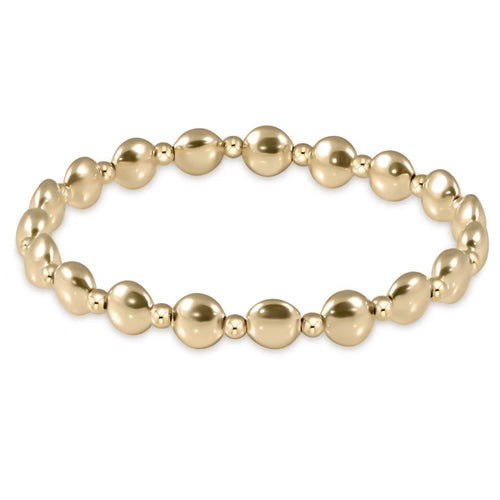 Honest Grateful Pattern gold 6mm bead bracelet by Enewton, showcasing a stylish accessory with textured gold beads.