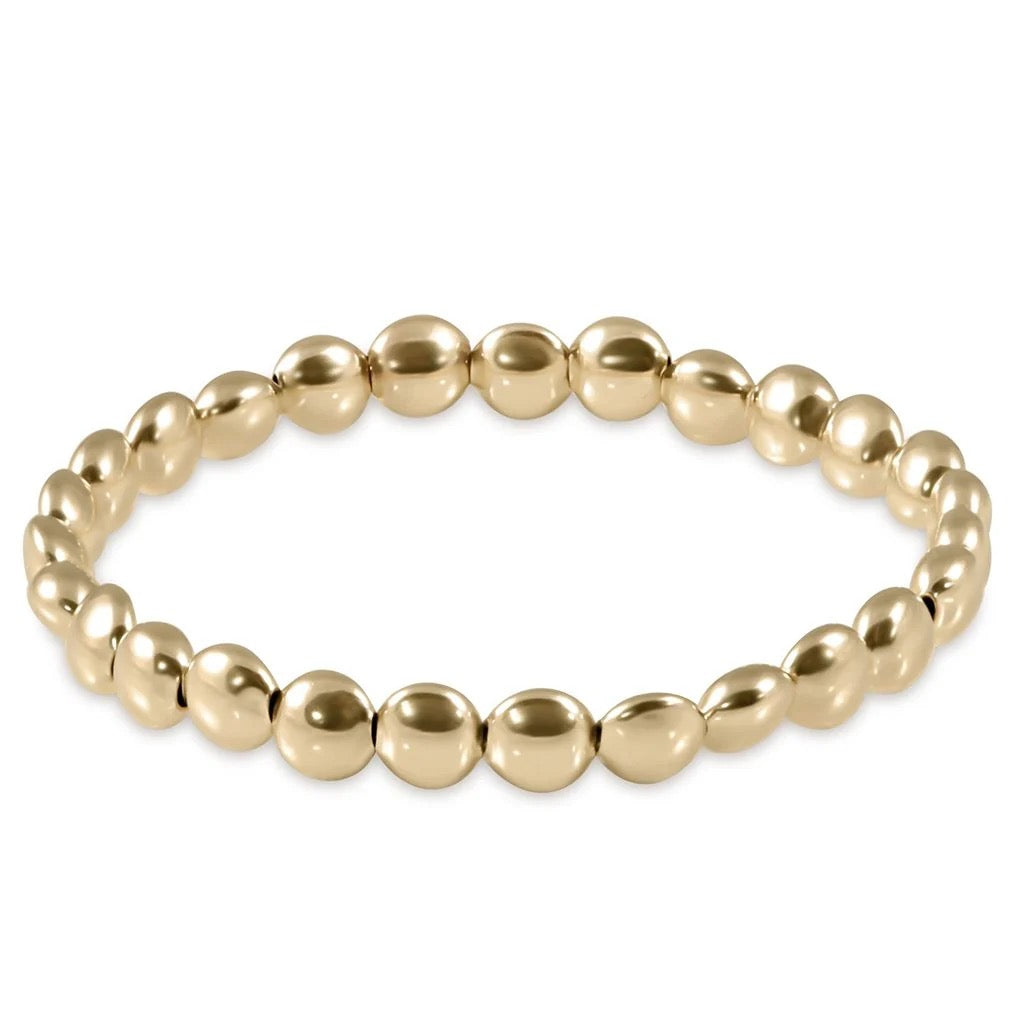 Enewton Honesty Gold 6mm bead bracelet featuring round gold beads and adjustable cord for stylish accessories.