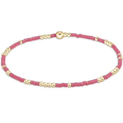 Bright pink Hope Unwritten bracelet by Enewton, a stylish accessory with engraved inspirational message, displayed on a neutral background.
