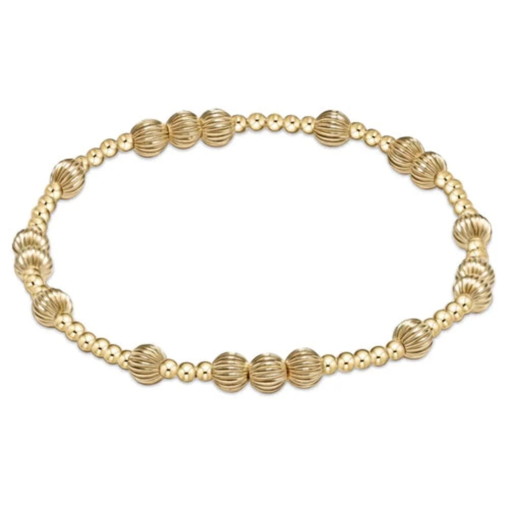 Enewton Hope Unwritten Dignity 5MM gold bracelet with delicate chain and minimalist design, worn on a woman's wrist.