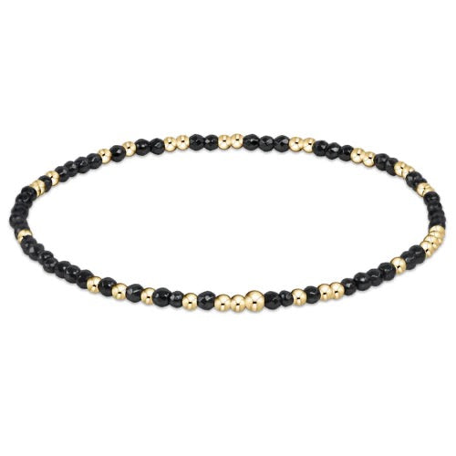 Enewton Hope Unwritten faceted hematite 2mm bead bracelet with a sleek, polished design and adjustable cord for accessories.