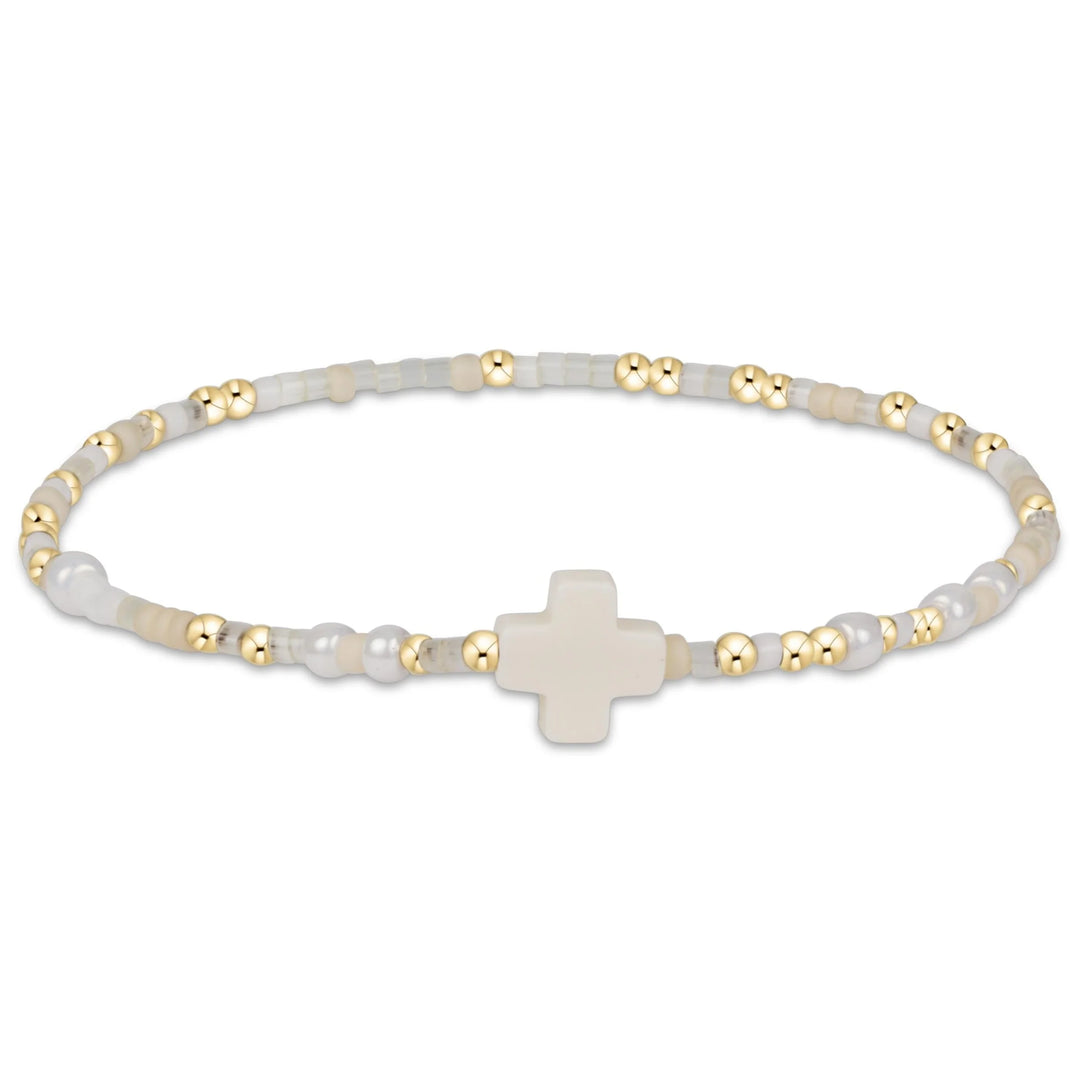 Enewton Hope Unwritten Signature Cross Bracelet with shellphone charm, silver-tone accessories, and detailed design.