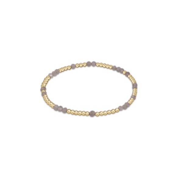 Hope Unwritten gemstone bracelet by Enewton, featuring colorful gemstones and elegant design, on a neutral background.
