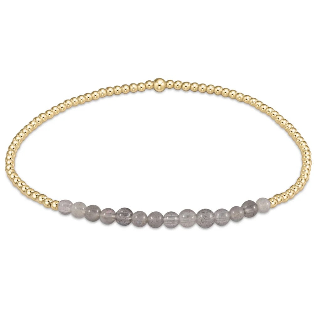 Enewton Gold Bliss 2MM Bead Bracelet with small gold beads on a delicate string, stylish accessories for everyday wear.