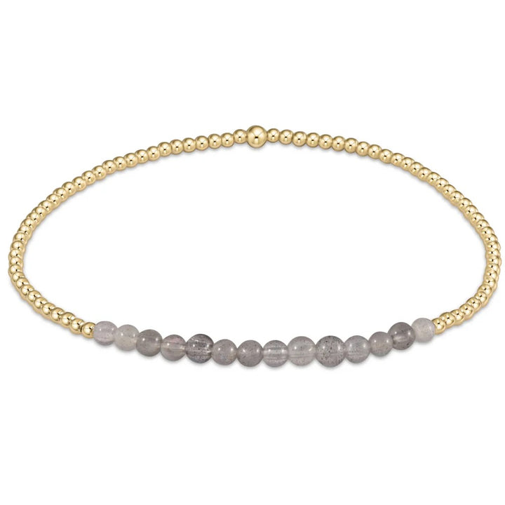 Enewton Gold Bliss 2MM Bead Bracelet with small gold beads on a delicate string, stylish accessories for everyday wear.