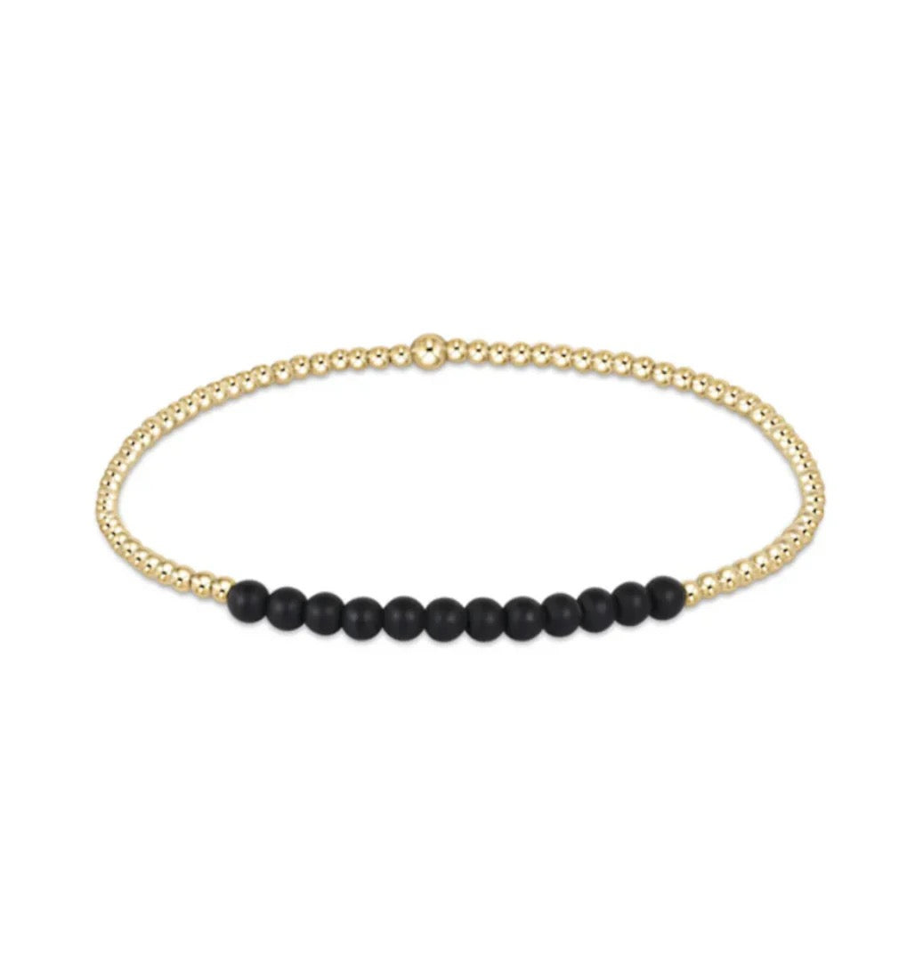 Enewton Gold Bliss 2MM Bead Bracelet featuring small gold beads on a delicate stretch cord.