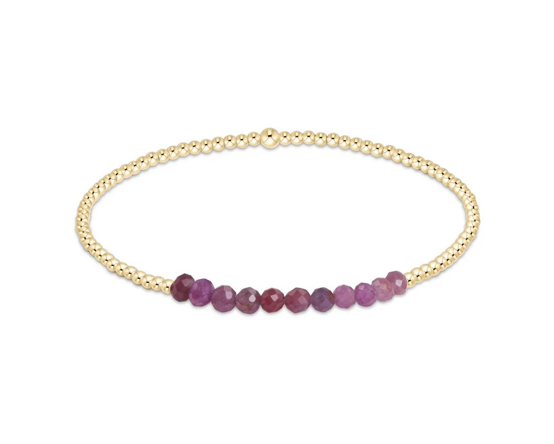 Enewton Gold Bliss 2MM Bead Bracelet featuring small gold beads on a delicate stretchy cord, stylish accessories for any outfit.