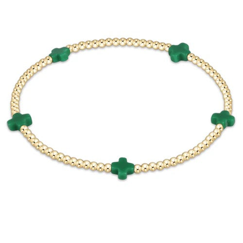 Enewton Signature Cross Small 2MM Gold Bracelet featuring a delicate cross charm on a thin gold chain.