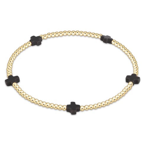 Enewton Signature Cross Small 2MM gold bracelet with delicate chain and cross pendant, elegant accessories for everyday wear.