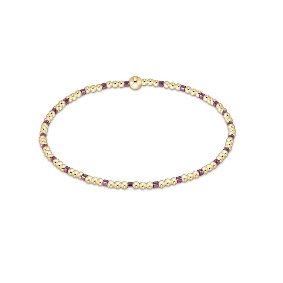 Enewton Hope Sincerity bracelets displayed on a neutral background, showcasing their delicate design and metallic finish.