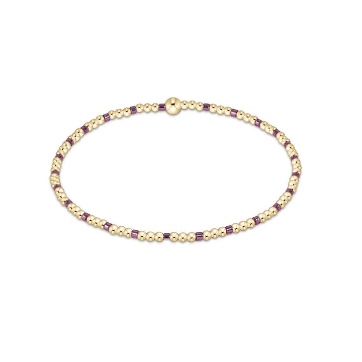 Enewton Hope Sincerity bracelets displayed on a neutral background, showcasing their delicate design and metallic finish.