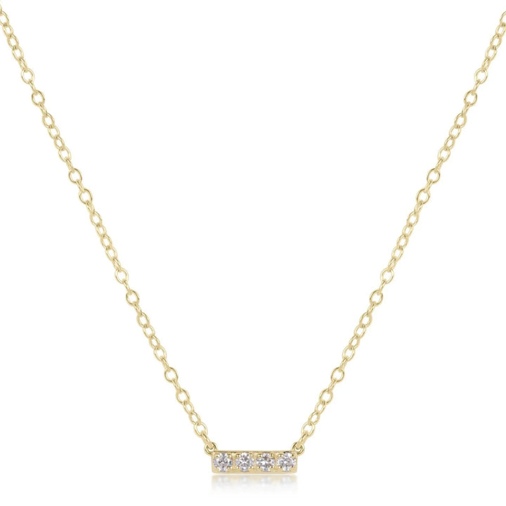 14K gold and diamond bar necklace by Enewton, showcasing a sleek, elegant jewelry piece with sparkling diamonds and a gold bar pendant.