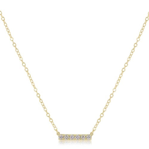 14K gold and diamond bar necklace by Enewton, featuring a sleek gold bar pendant with small sparkling diamonds.