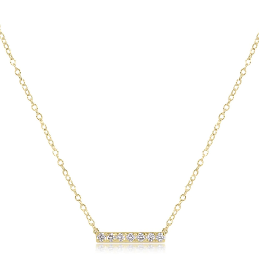 14K gold and diamond bar necklace from Enewton, showcasing a sleek gold bar pendant with sparkling diamonds on a delicate chain.