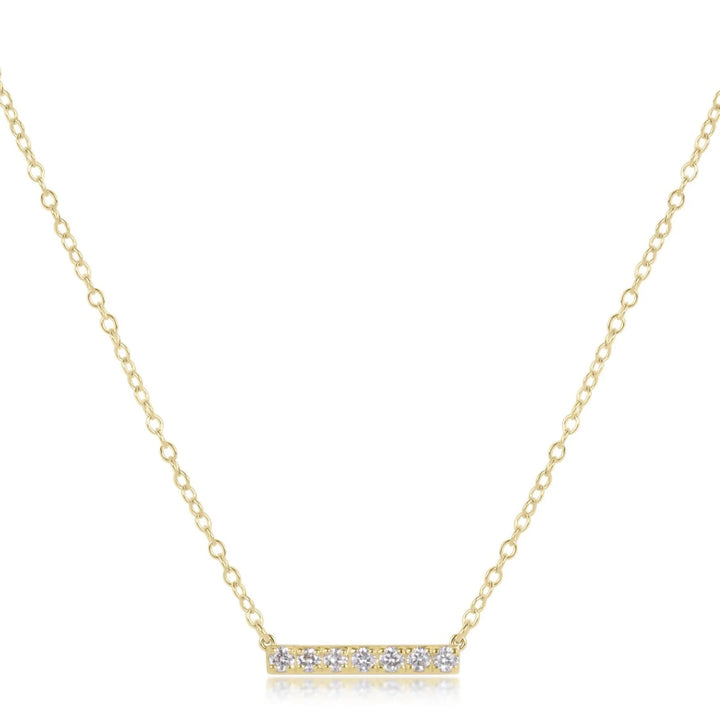 14K gold and diamond bar necklace from Enewton, showcasing a sleek gold bar pendant with sparkling diamonds on a delicate chain.