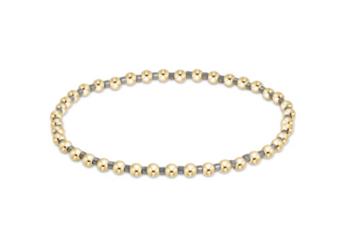 Enewton Hope Grateful bracelet featuring a silver-toned charm and black cord, laid flat on a white background.