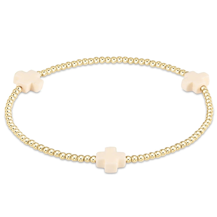 Gold Signature Cross 2mm bracelet by Enewton featuring a delicate chain and small cross pendant, perfect for accessories.
