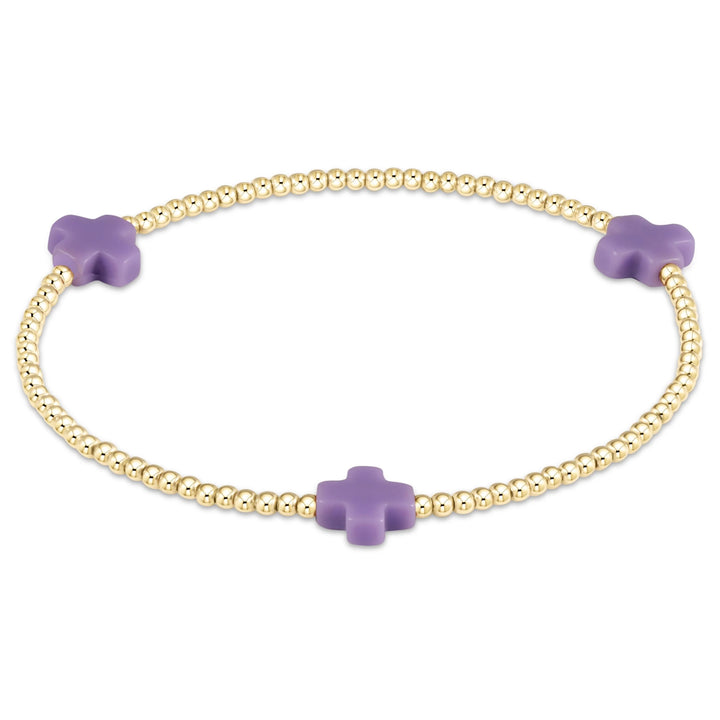 Enewton Signature Cross 2mm gold bracelet, delicate accessory with a small cross charm, stylish and lightweight jewelry piece.