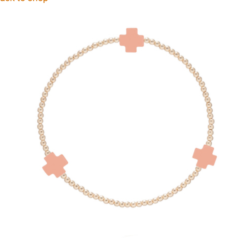 Enewton Signature Cross 2mm gold bracelet, stylish accessories with a sleek cross design, close-up view of the jewelry.