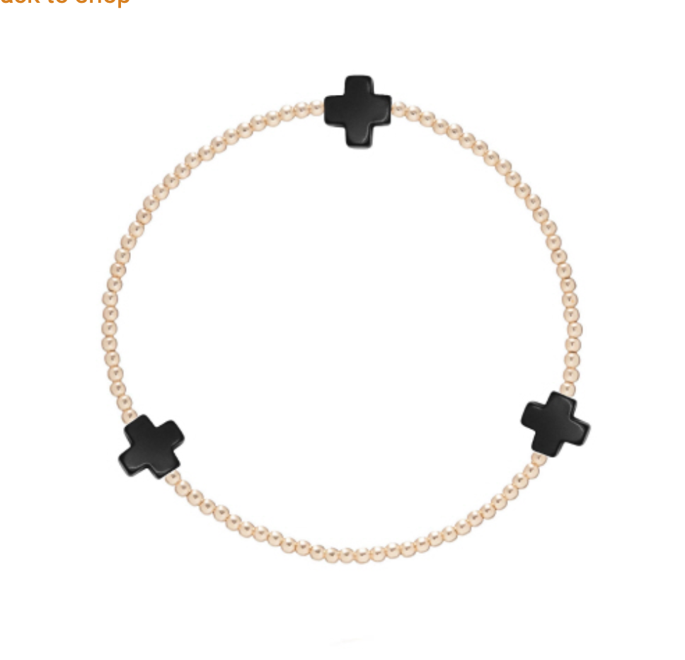 Gold Signature Cross 2mm bracelet by Enewton, featuring a delicate cross charm on a thin gold chain.