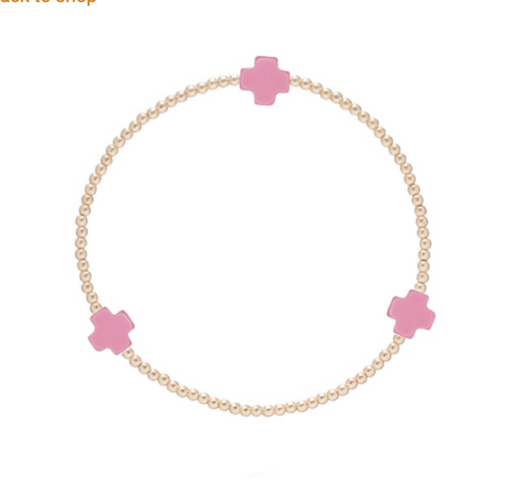Gold Signature Cross 2mm bracelet by Enewton, featuring a delicate chain and small cross pendant, styled as a jewelry accessory.