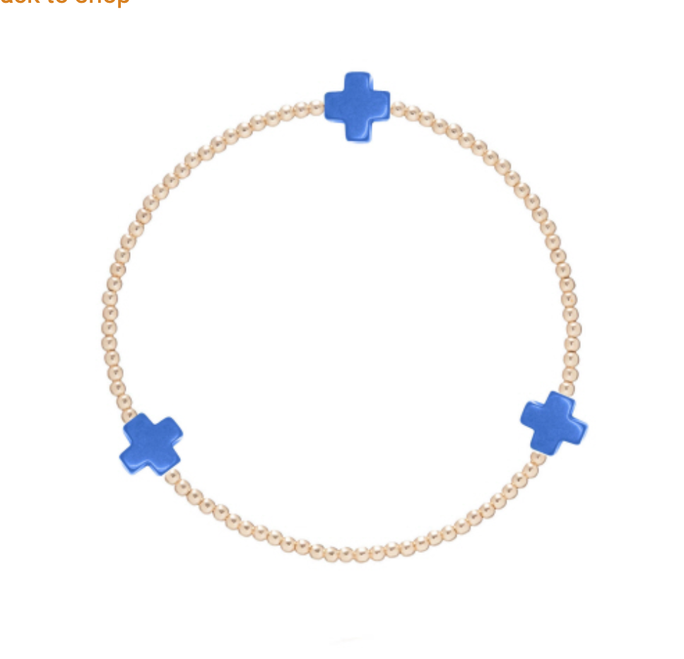 Gold Signature Cross 2mm bracelet by Enewton, featuring a sleek cross charm on a thin, elegant gold chain.