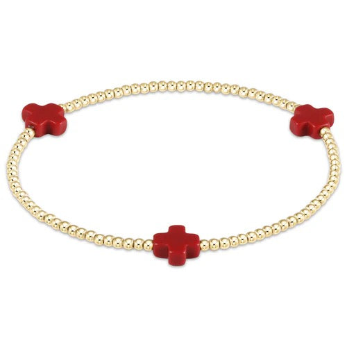 Enewton Signature Cross 2mm gold bracelet, stylish accessory with a sleek cross charm, on a neutral background.