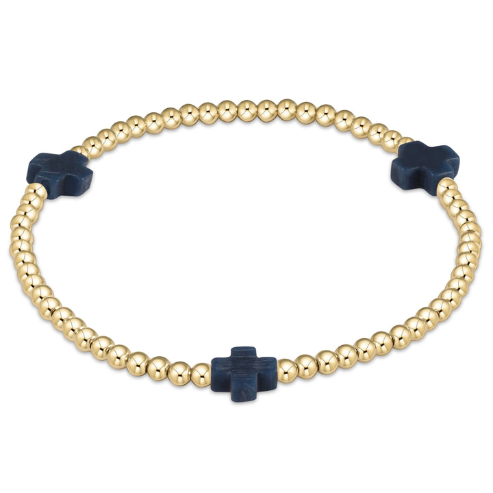 Enewton Signature Cross 3mm bracelet featuring a sleek metal cross charm on a black cord accessory.