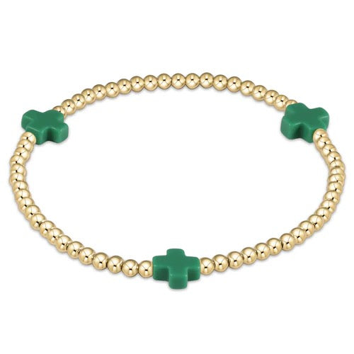 Enewton Signature Cross 3mm bracelet with silver-toned chain and cross charm, close-up of accessory on a neutral background.