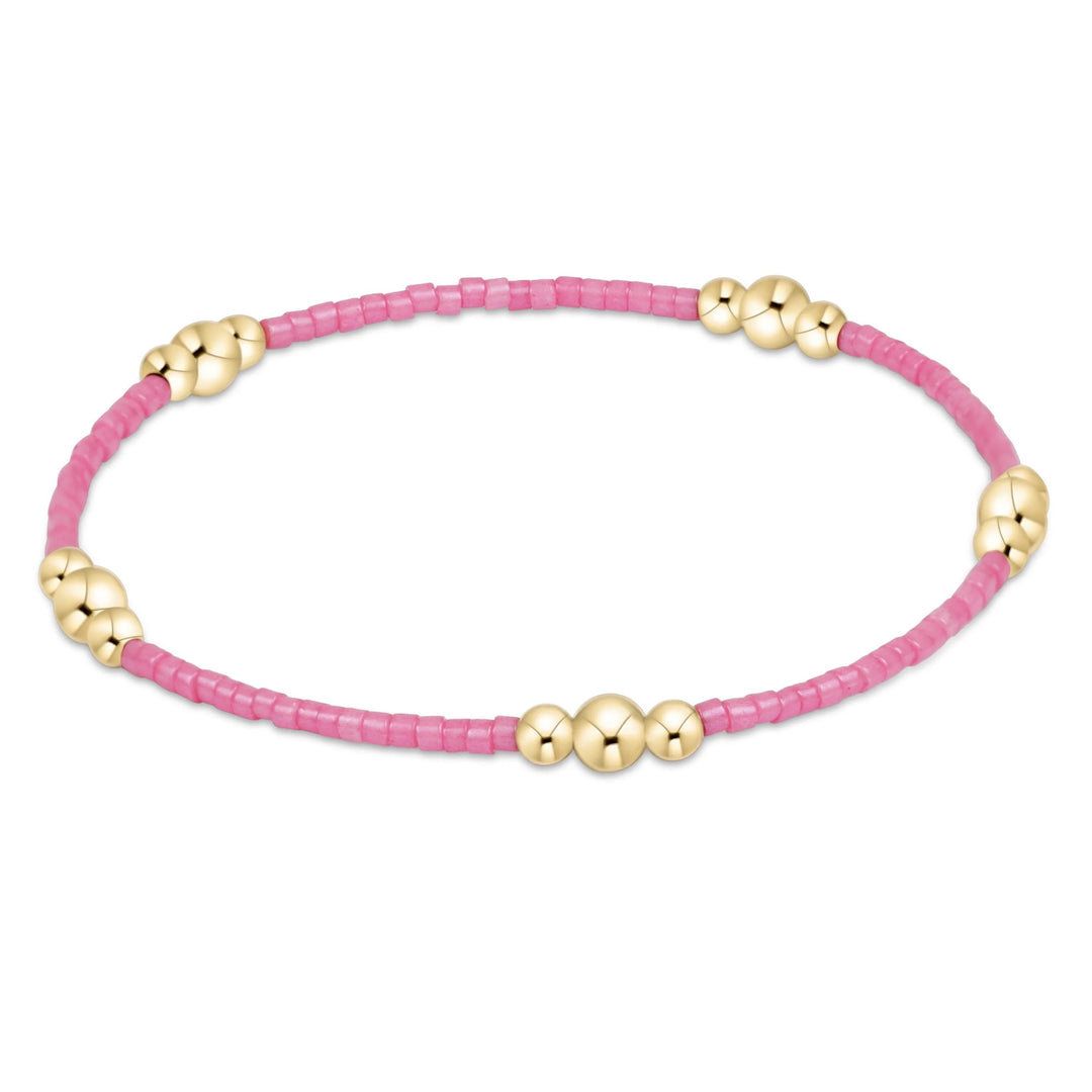 Enewton Hope Purpose Gold Bracelet featuring attached bubblegum-colored beads and a delicate chain design.