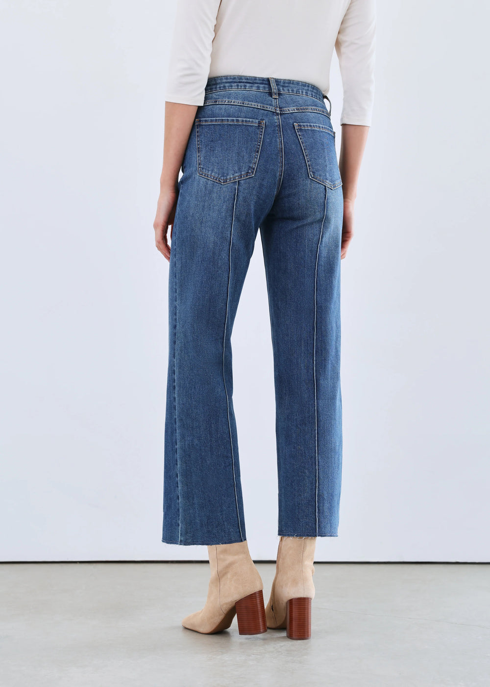 FDJ Olivia Wide Ankle Jean showcasing a high-waisted, light-wash denim bottoms with a relaxed fit and wide ankle cuffs.