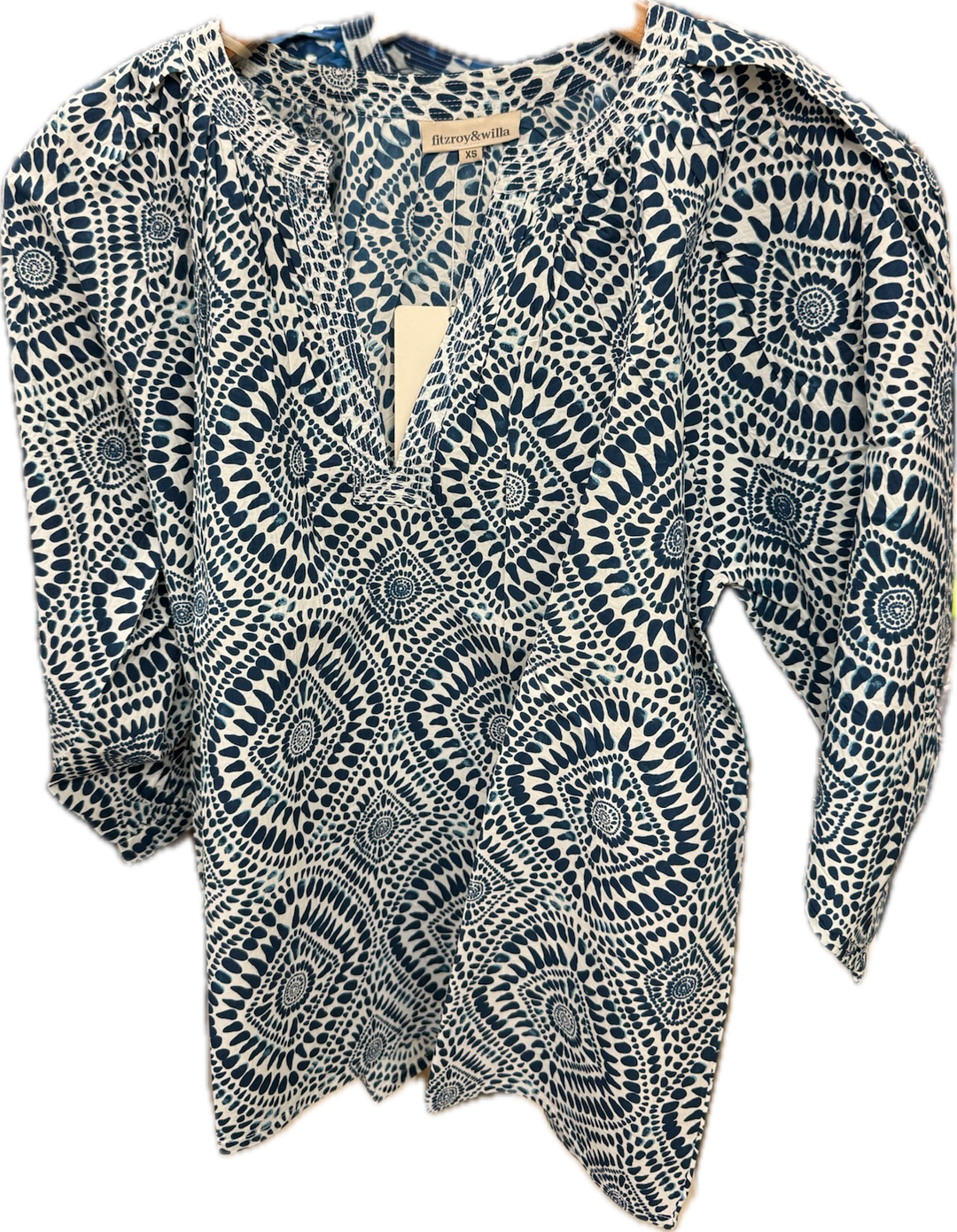 Fitzroy & Willa Sallie Blue Batik Blouse, lightweight tops with vibrant blue and batik pattern, shown on a hanger.