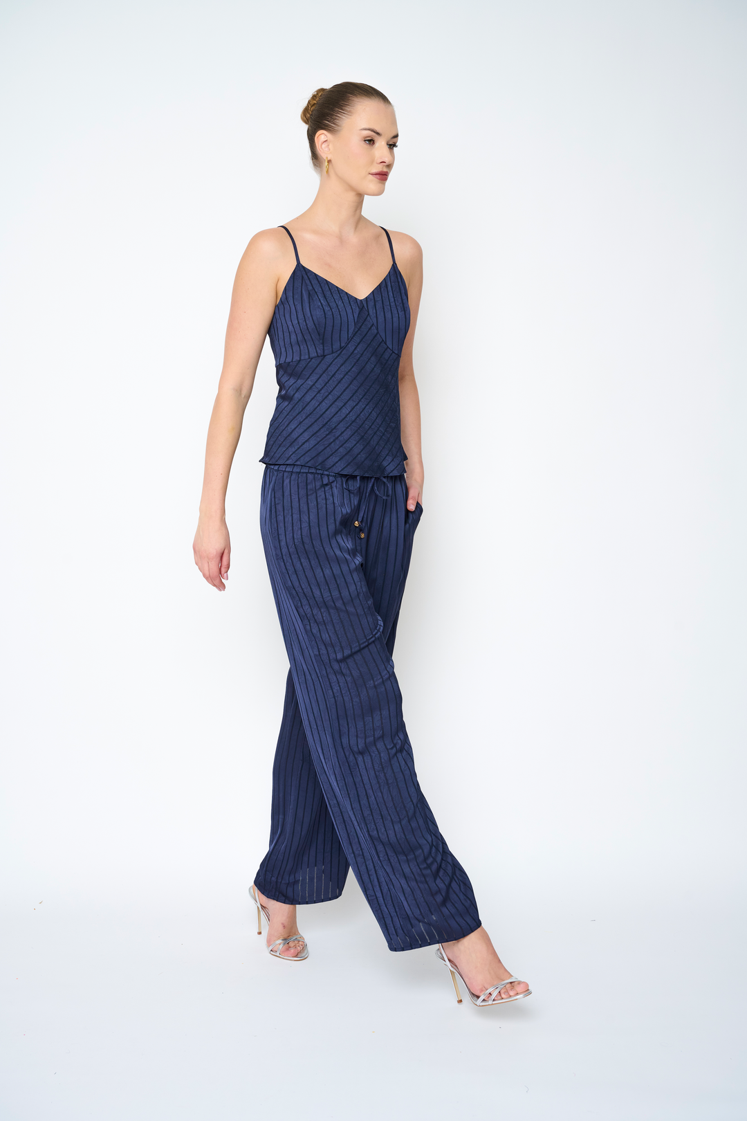 Navy Stephani pants by Flora Bea, stylish women's bottoms with a tailored fit and smooth fabric, displayed on a white background.