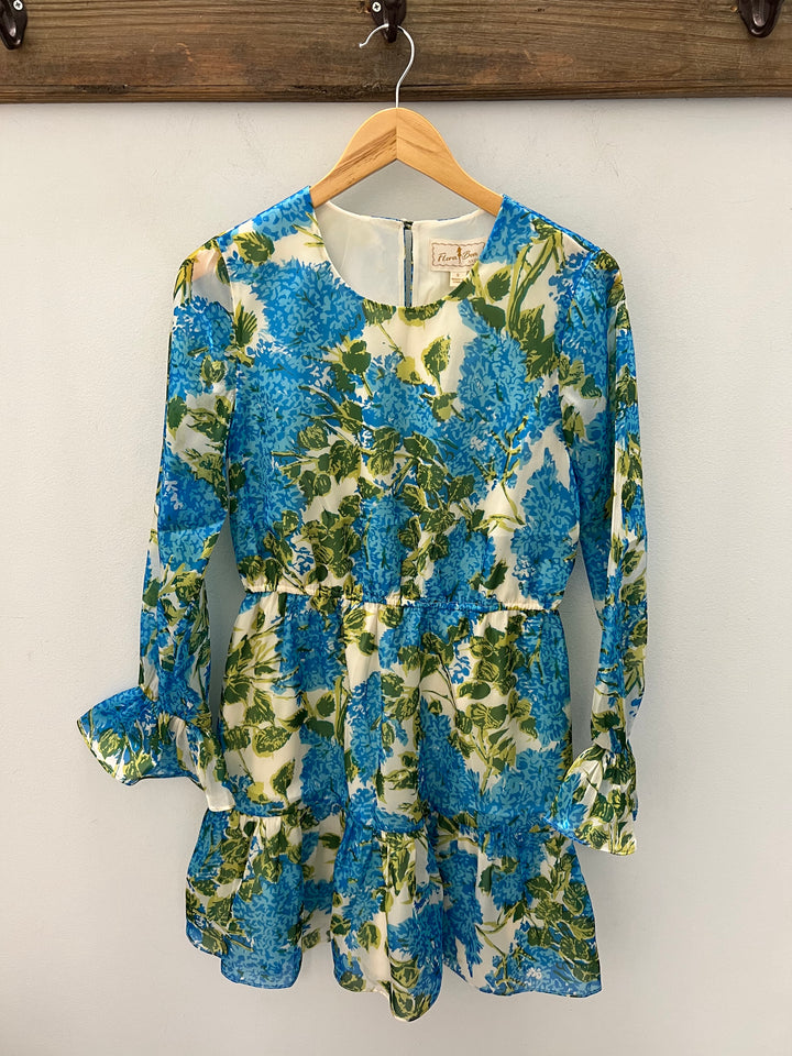 Flora Bea Monel Antigua dress displayed on a hanger, featuring lightweight fabric and intricate design details for women's dresses.