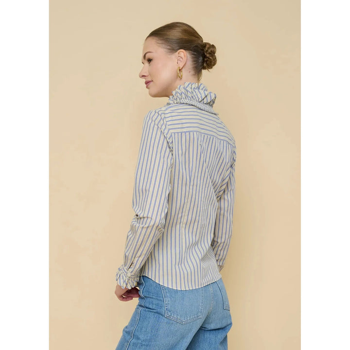Flora Bea Indie Ruffle Blouse featuring feminine ruffle details and lightweight fabric, perfect for stylish tops.