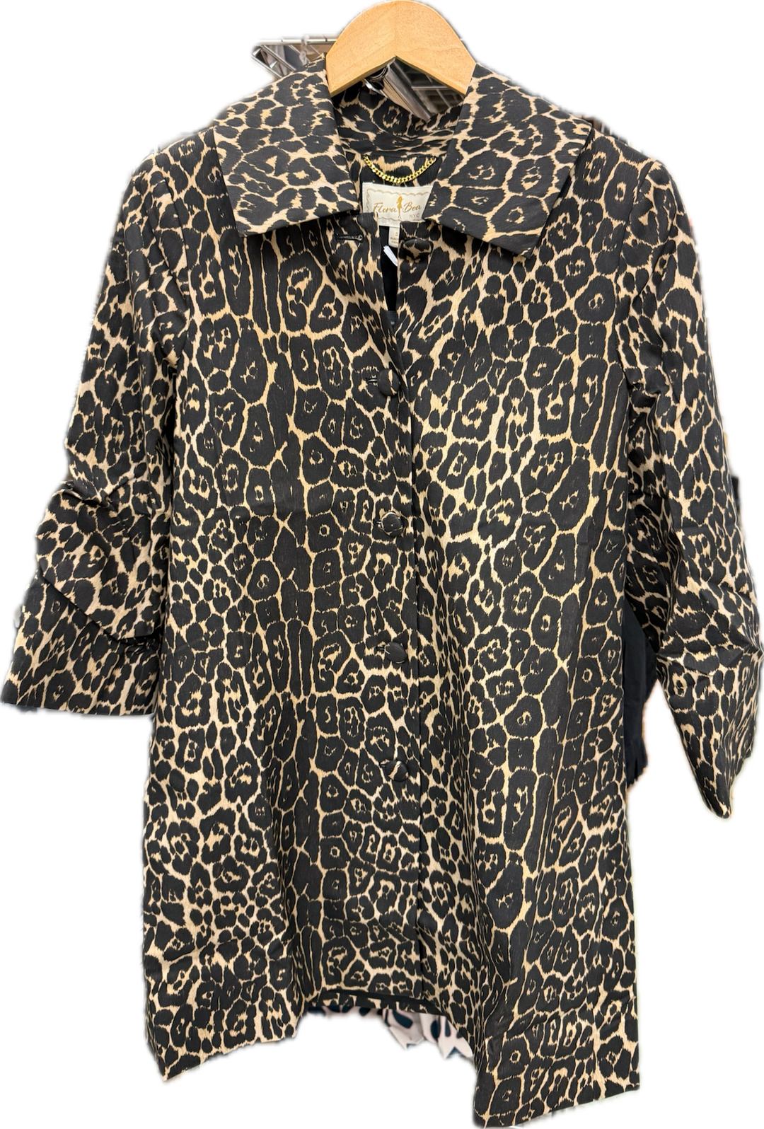 Flora Bea Millie Starry Night coat, a stylish top with starry night pattern, shown in a close-up image highlighting fabric details.