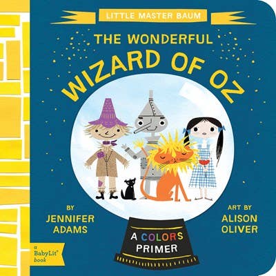 Open book titled "Wizard of Oz: Colors Primer" by Gibbs Smith, featuring colorful illustrations on the cover.