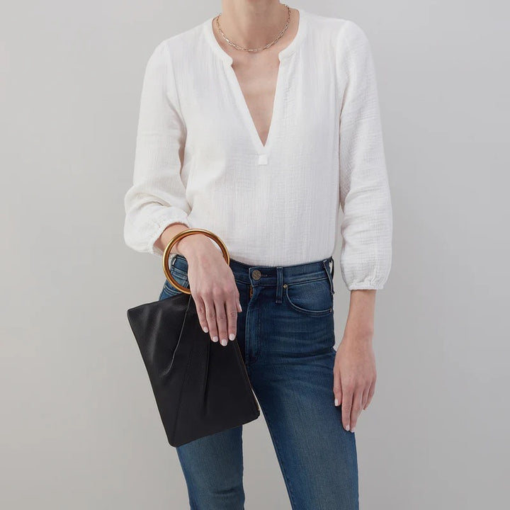 Black Sheila Ring Clutch by Hobo Bags, elegant accessories with a sleek design, featuring a ring detail and compact size.