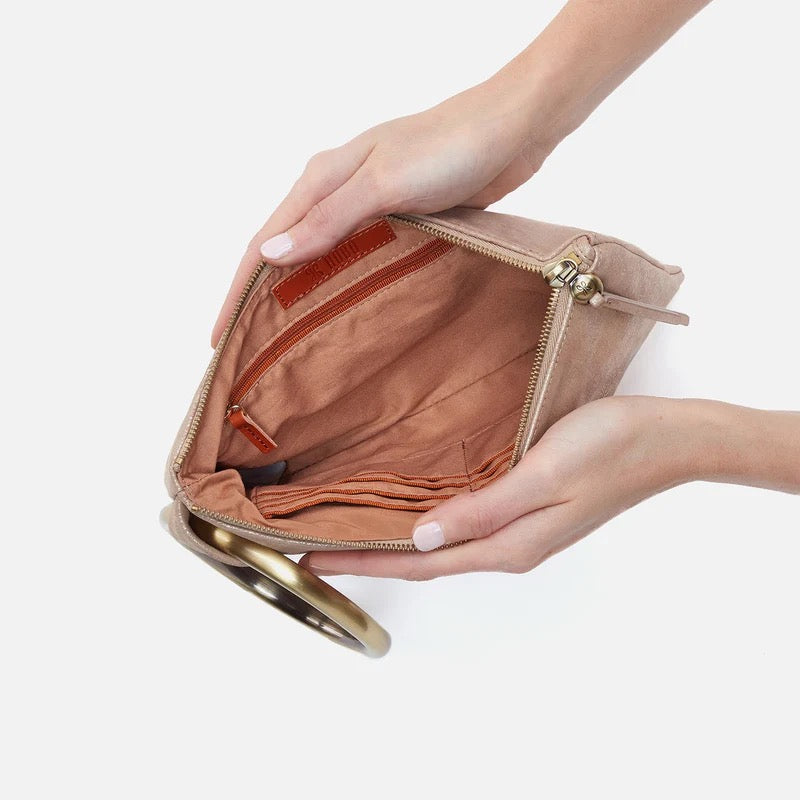 Hobo Bags Sheila Ring Clutch in gilded beige with a sleek design and metallic ring detail, perfect for stylish accessories.