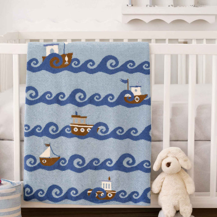 In2Green Boats cotton baby blanket with colorful boat pattern, soft and cozy gift for infants.