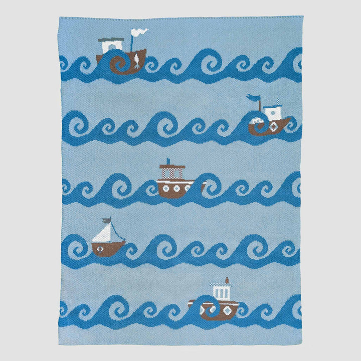 Soft Boats Cotton Baby Blanket from In2Green, featuring a gentle, cozy design perfect for gifting a newborn.