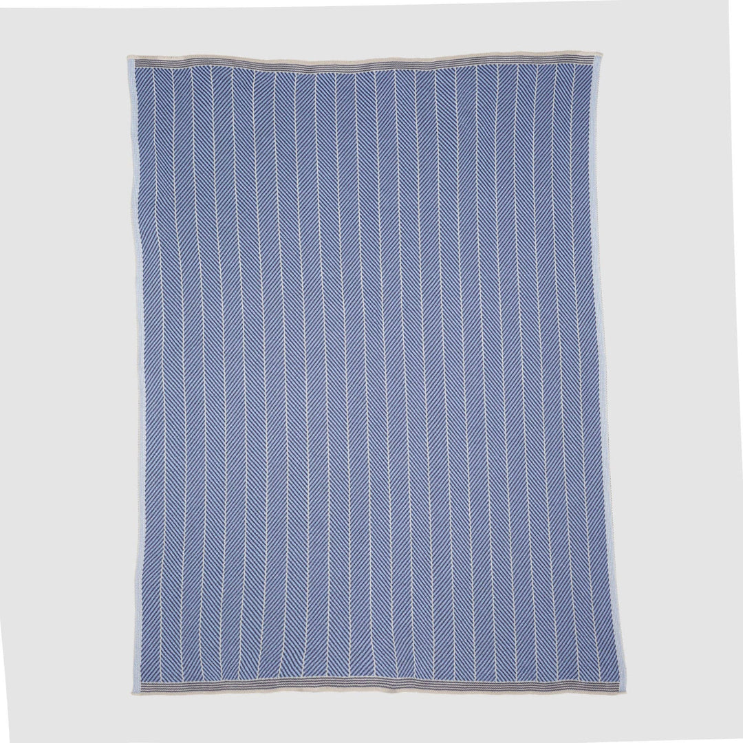 In2Green chevron throw blanket for indoor and outdoor use, featuring a stylish zigzag pattern in neutral tones.
