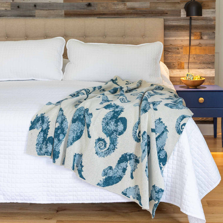 Watercolor seahorse cotton throw blanket with vibrant ocean-inspired design, perfect for home decor by In2Green.