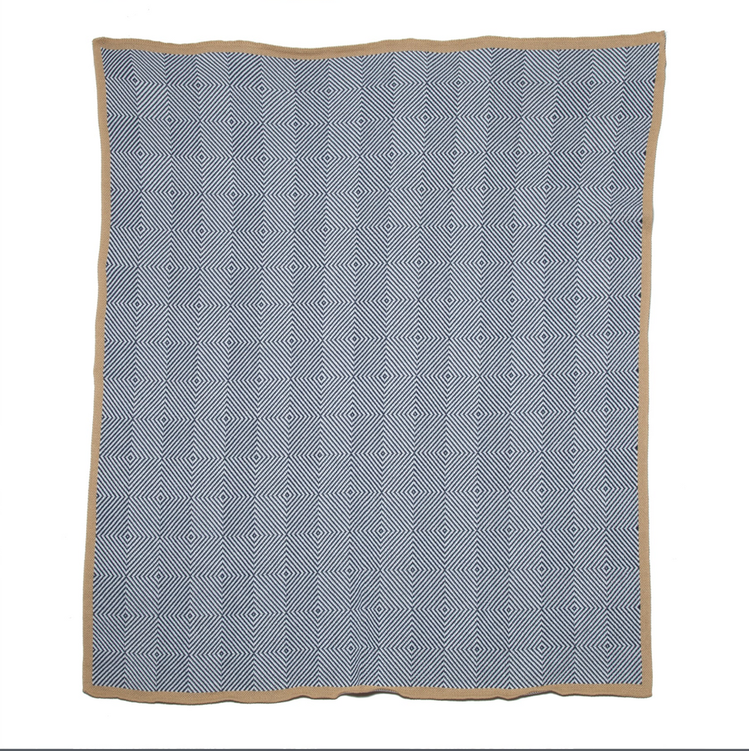 In2Green outdoor woven trim throw with textured fabric and natural woven pattern, ideal for home decor and outdoor lounging.