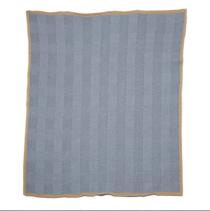 In2Green outdoor woven trim throw with textured fabric and natural woven pattern, ideal for home decor and outdoor lounging.